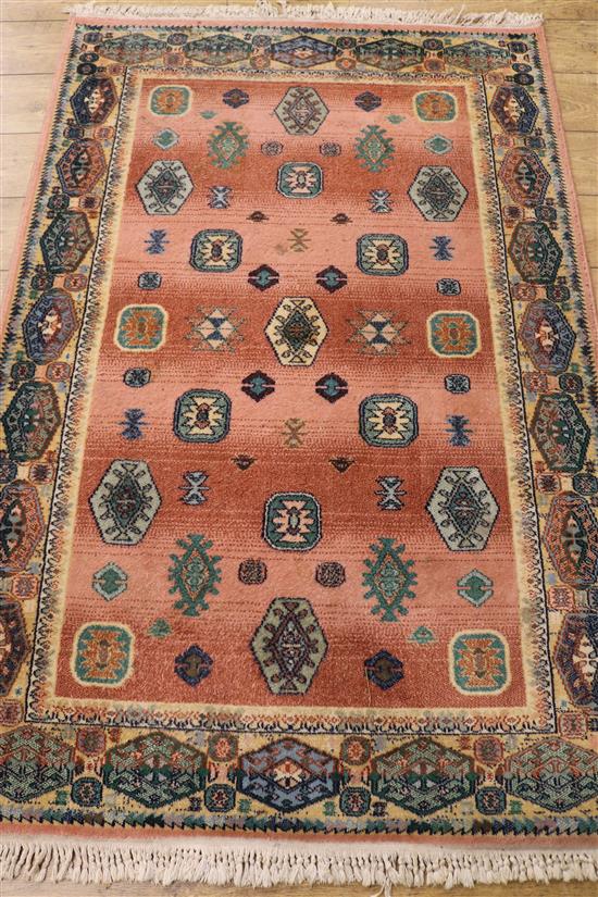 A Marks & Spencers Egyptian made pink ground rug, 5ft 11in. x 3ft 11in.